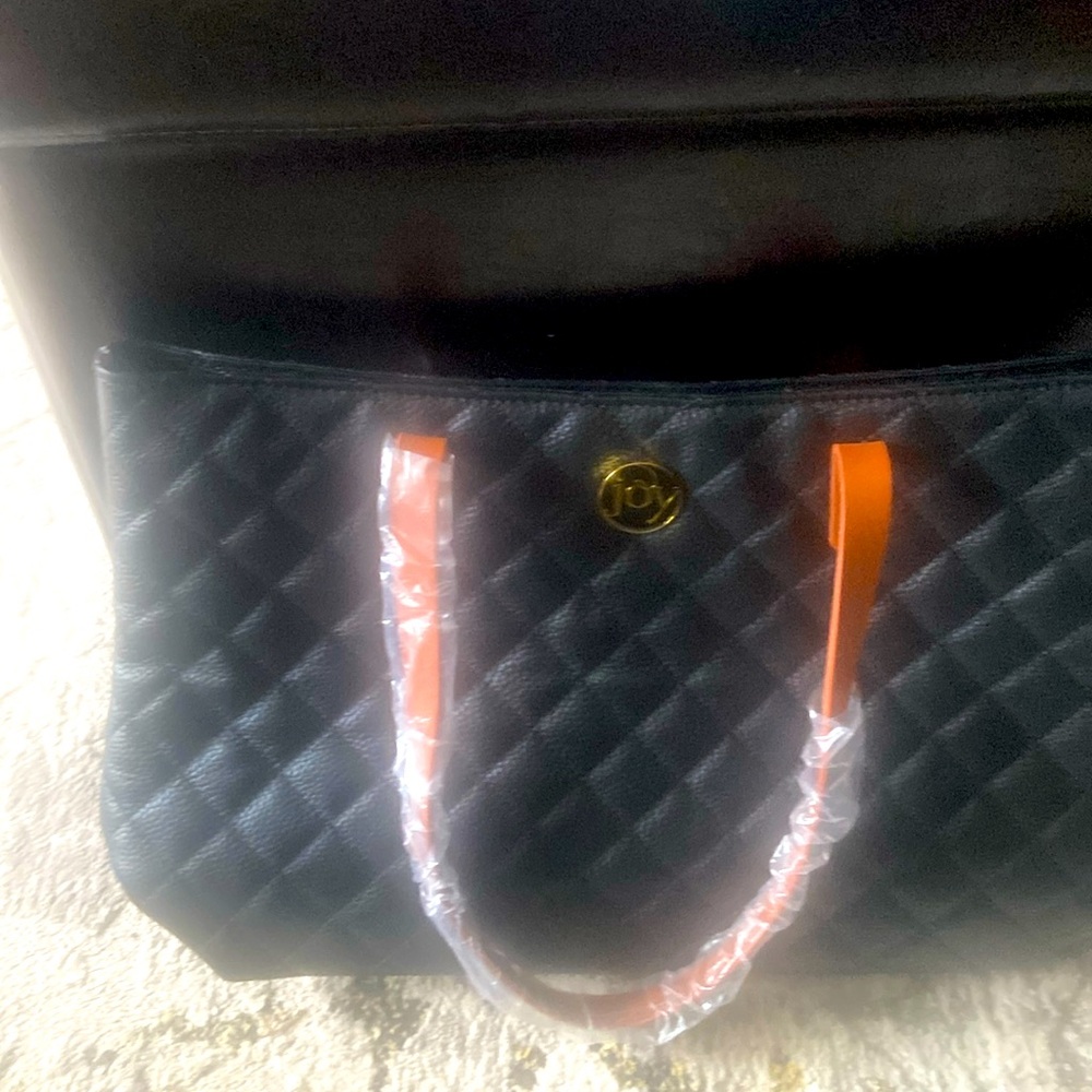 Joy handbag all leather rfid  protected ice and room never used